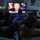 Migrants view a live televised speech by President Donald Trump on border security at a shelter for migrants on January 8, 2019 in Tijuana, Mexico. Tijuana continues to house migrants, many of whom are hoping to cross the border into the U.S.